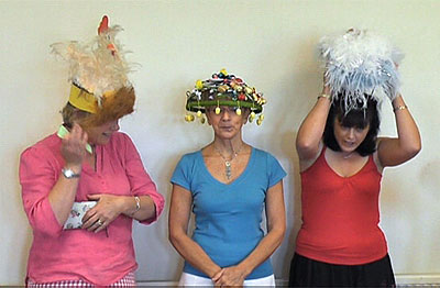 The Easter Bonnet competitors await the judge's decision