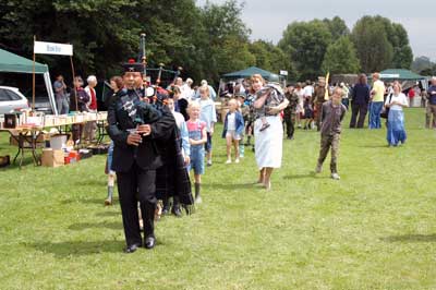 Contestants for the Fancy Dress arrive behind a Gurkha piper 