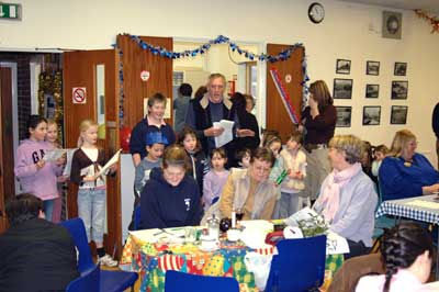 Carol singing was led by Geoff Sykes and accompanied on the piano by wife, Sue, musical director of the Froyle Players for many years