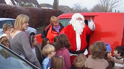 Santa Claus dropped in to give presents to the children