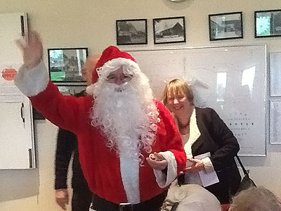Santa went round the Hall giving gifts to everyone
